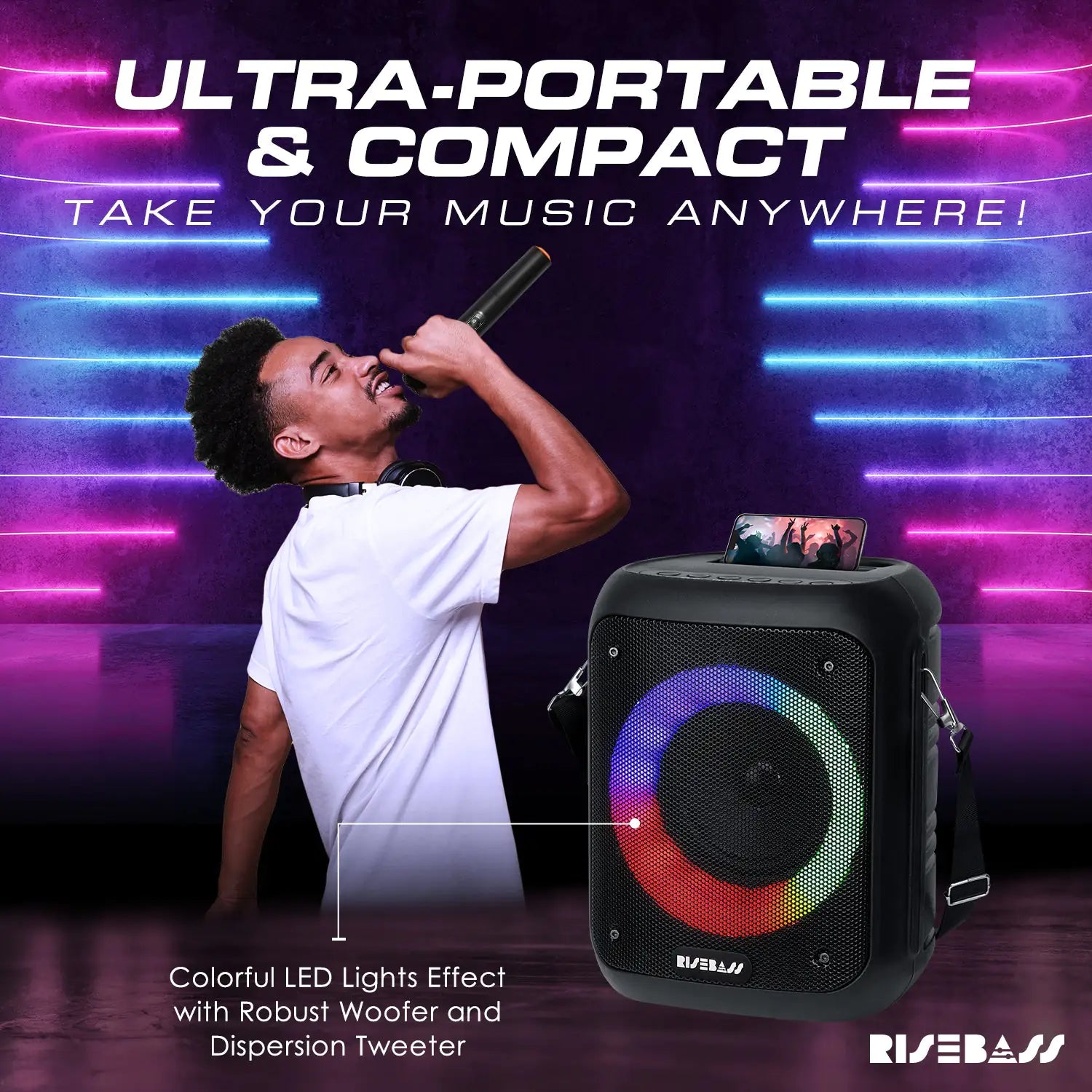 karaoke machine with LED lights and 2 wireless microphones. phone on top of sing machine.  Man singing music